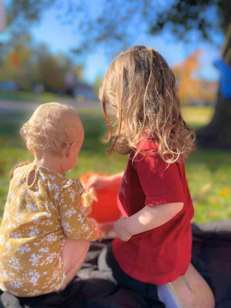 Preschooler with Montessori inspired pumpkin activities