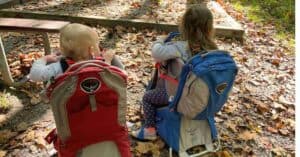 Baby and preschooler ready for a hike in hiking backpack carriers