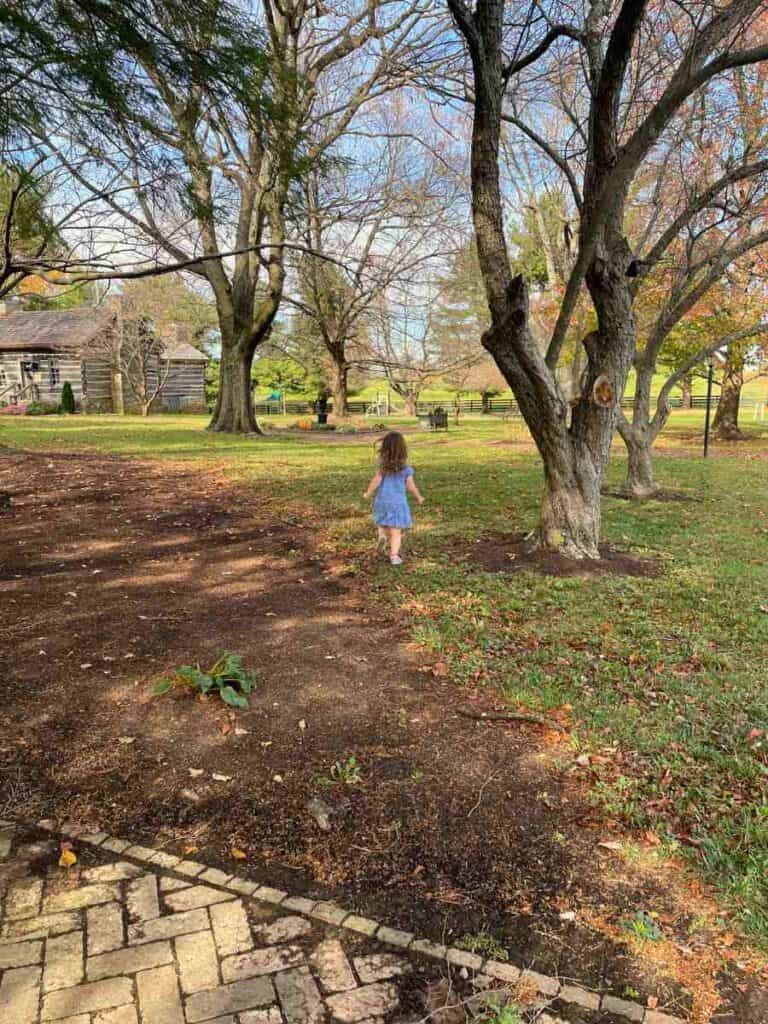 Preschooler exploring the grounds of Waveland State Historic Site in Lexington, KY
