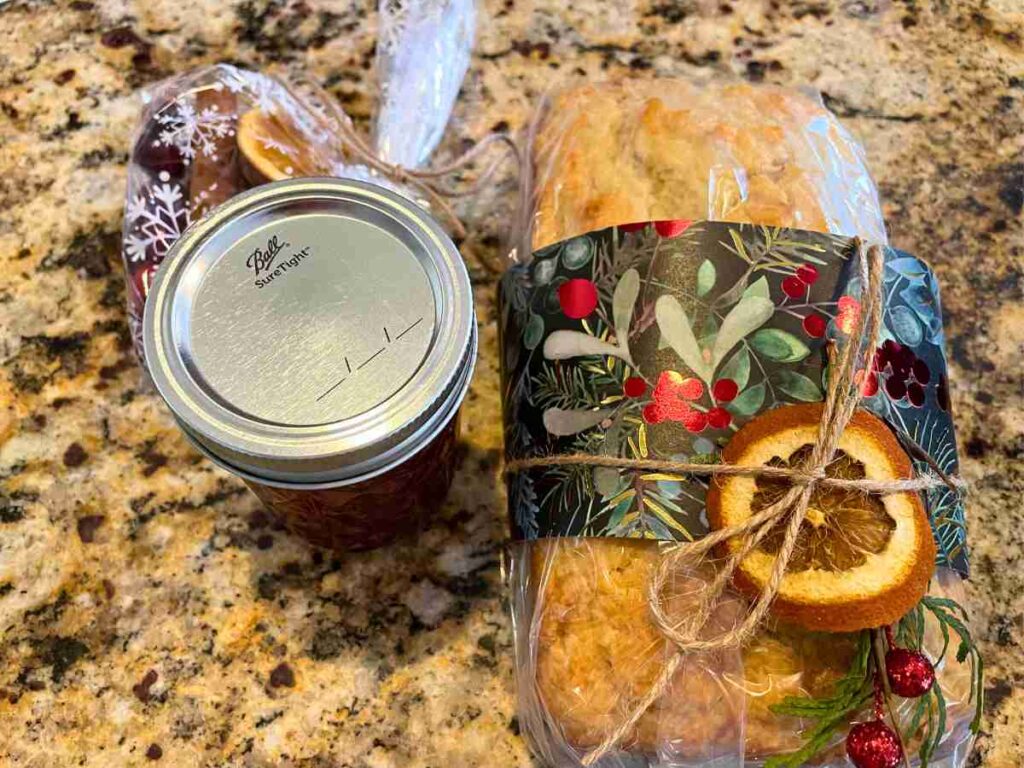 Christmas bread wrapped with paper and a Christmas stove top potpourri bundle