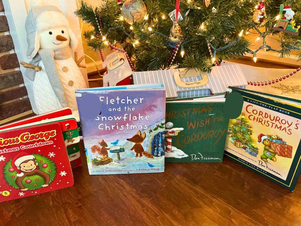 Christmas preschool books by a Christmas tree