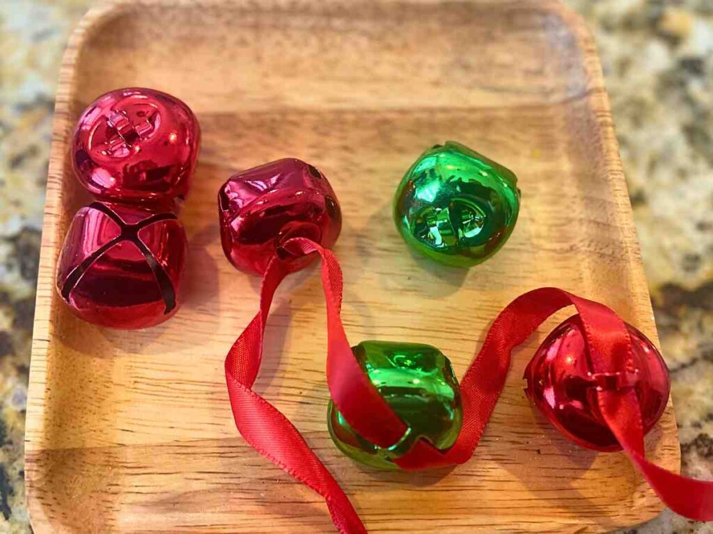 Stringing jingle bells Montessori Christmas activity 